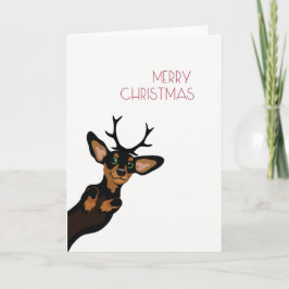 Dachshund lindo con Felices Navidad de las astas
