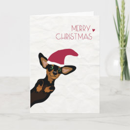 Dachshund lindo con Felices Navidad del gorra de