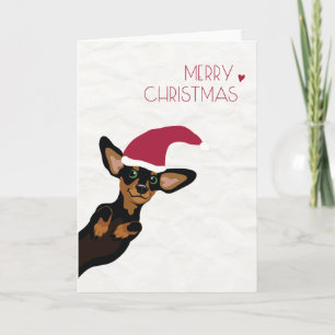 Dachshund lindo con Felices Navidad del gorra de
