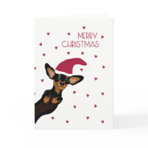 Dachshund lindo con Felices Navidad del gorra de