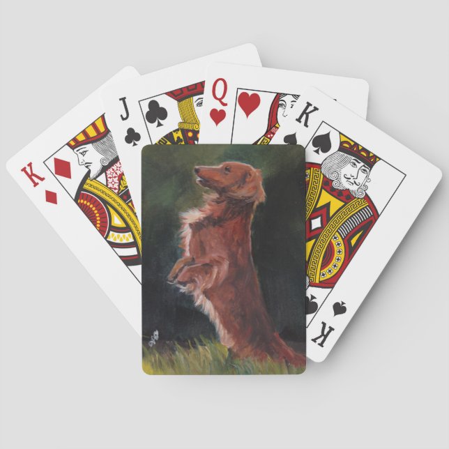 Dachshund que se sienta encima de naipes del arte (Reverso)