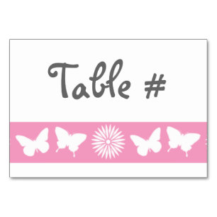 Daisies y mariposas en tarjeta de mesa rosada Peta