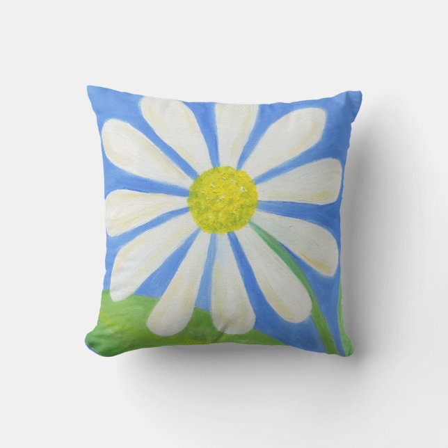 Daisy blanco sobre almohada azul (Anverso)