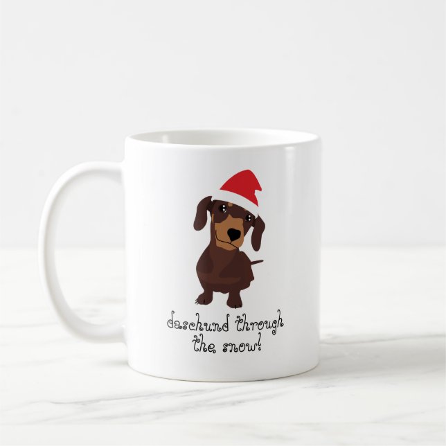 Daschund lindo a través de la taza de Navidad de (Izquierda)