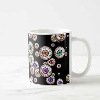 De Café Globos del ojo dispersados espeluznantes - taza