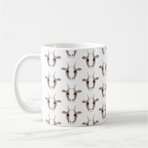 Gris y cabras blancas en la taza