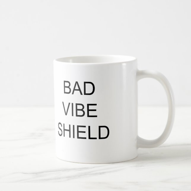 DE CAFÉ MALA TAZA DEL ESCUDO DEL AMBIENTE (Derecha)