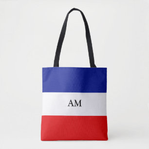 De Tela Monograma en bolso tote a rayas azules rojas y bla
