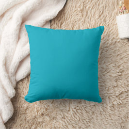 Decorativo cojín cuadrado de color verde azulado aparece cent