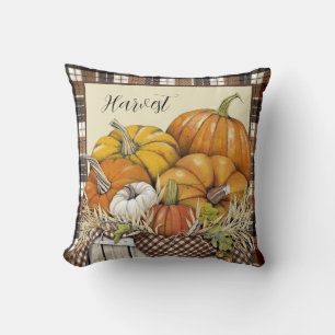 Decorativo cojín de cuadros de otoño y calabazas