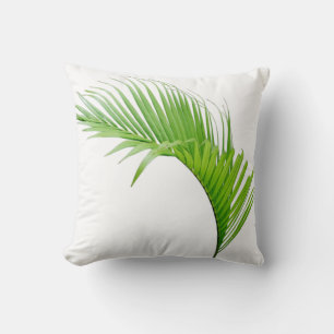 Decorativo Hoja verde de palma tropical en cojín blanco