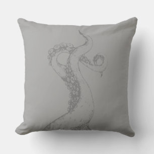 Decorativo tentáculos de pulpo grises sobre cojín gris