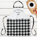 Delantal Añadir su imagen o logotipo, negro blanco con pape<br><div class="desc">Personalice este bonito delantal de patrón a cuadros en blanco y negro con su propia imagen o logotipo en la sección blanca superior. Ideal para añadir el logotipo de la empresa o imágenes personales haciendo de esta plataforma su propia creación! Excelente idea de regalo única o como parte del uniforme...</div>