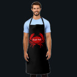 Delantal Apron<br><div class="desc">Apron mostrado en negro con una gran huella de cangrejo rojo con texto de cangrejo. Color Black Personalizar este artículo o compra tal como está.</div>