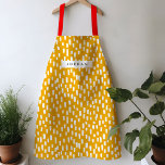 Delantal Aprón dorado<br><div class="desc">Luminoso y alegre,  este delantal de colores vivos presenta guiones dibujados a mano para un juego de patrones durante todo el año. Personaliza con tu propio nombre o dá como un regalo práctico y atento!</div>