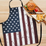 Delantal Bandera estadounidense Estrellas patrióticas<br><div class="desc">Muestra tu orgullo americano o da un regalo especial con este delantal de la bandera estadounidense en un desgastado diseño. Este diseño de delantal bbq de la bandera de los estados unidos con estrellas y rayas en blanco y azul rojo es perfecto para el cuarto de julio de fiestas bbq,...</div>