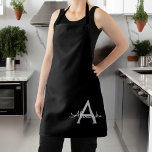 Delantal Black Silver Modern Script Girly Monograma Nombre<br><div class="desc">Nombre de Monograma Negro y Plata Apron. Esto hace que el dulce perfecto cumpleaños 16,  boda,  ducha de novia,  aniversario,  ducha de bebé o fiesta de soltera sea regalo para alguien que ama el lujo glam y los estilos de moda.</div>