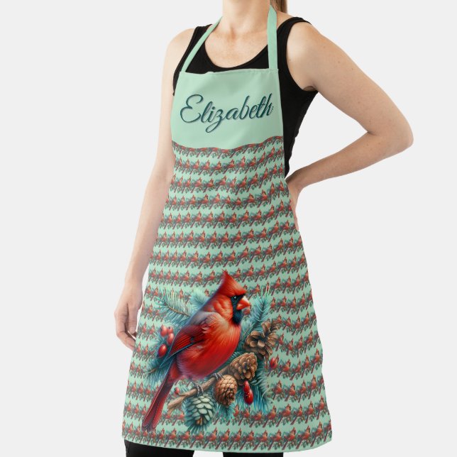 Delantal Cardenal en rama de pino con bayas de invierno (in situ)