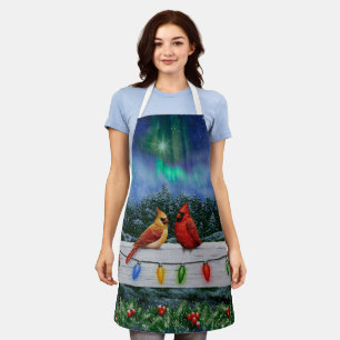 Delantal Cardenales y Navidades iluminan la nieve de invier