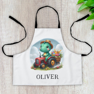 Delantal Dinosaurio de Trex Cute que conduce un tractor roj