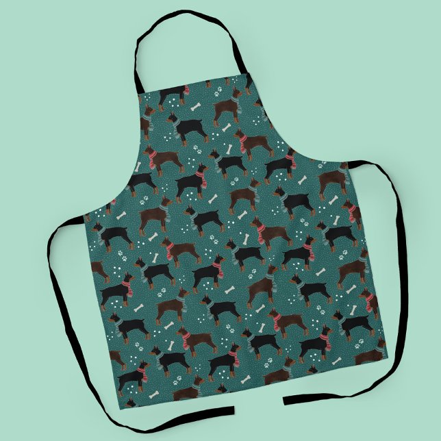 Delantal Dobermanes rojos y negros en el patrón invernal de (Winter Dobermans in Scarves Pattern Apron)