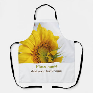 Delantal El jardín de girasol amarillo añade el nombre de t