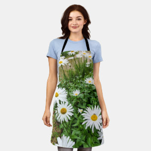 Delantal El Leucanthemum florece por todo el sector impreso