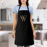 Delantal Elegante guión Monograma inicial de oro negro<br><div class="desc">Elegante jovencito negro y dorado nombre de guión monograma inicial con nombre delantal. Puede personalizar el nombre,  el monograma y el personalizar del tipo de letra y los colores para crear su propio diseño único. Diseñado por Thisisnotme©</div>