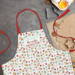 Delantal Festividad con estampado de Navidades de niños de<br><div class="desc">Este bonito delantal con estampado de "Cookie Monster" presenta galletas de Navidades azucaradas decoradas festivamente en forma de copos de nieve, hombres de nieve, árboles de Navidad, adornos y estrellas. Personaliza con el nombre de tu monstruo favorito de galletas para un regalo dulce y personalizado este año (y una oportunidad...</div>