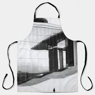 DELANTAL FOTO EN GRAYSCALE DE UN HOMBRE CAMINANDO EN PAVEME