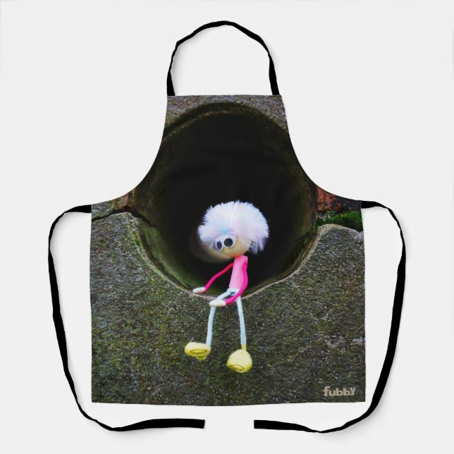 Delantal Fubby poppetje dat in een muur zit. (Anverso)