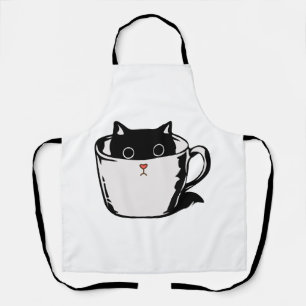 Delantal Gatito negro con nariz roja escondido en una taza