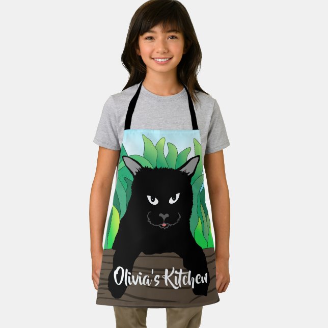 Delantal Gato negro colgando, todo sobre papel de impresión (in situ)