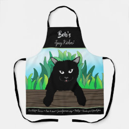 Delantal Gato negro en la valla con hierba verde