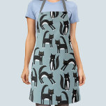 Delantal Gatos de Tuxedo en blanco y negro<br><div class="desc">Los gatos de esmoquin blanco y negro que se dedican a sus asuntos. Un patrón divertido en un fondo azul medio. Arte original de Nic Squirrell.</div>