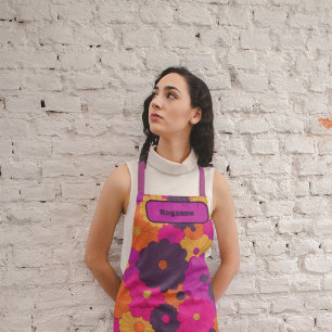 Delantal Groovy poder de flores hippie morado y rosa