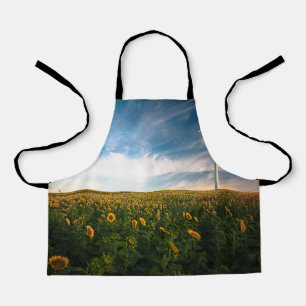 Delantal hermoso campo de flores solares con cielo azul tur
