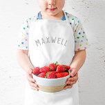 Delantal Infantil Monograma de nombre personalizado | Gris<br><div class="desc">Estos delantales personalizados para los niños incluyen el nombre de su hijo en una moderna letra abovedada, lo que los hace perfectos para los chefs que ayudan en la cocina, en juegos de ropa creativos o como cigarrillos de artista para proteger la ropa durante la elaboración. Fabricados con tejidos duraderos...</div>
