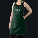 Delantal Iniciales monográficas personalizados modernas de<br><div class="desc">Las iniciales del monograma personalizado moderno son Apron blanco oscuro verde. letras blancas, fondo rosa claro. Puedes elegir tu color de correa. ¡Un gran regalo para mamá, amigos y tú mismo! Diseño moderno, minimalista, sencillo y elegante. Excelente para cocineros, chefs, cerámica, artesanía, trabajo, cocina, horneado, barbacoa, parrilladas, comercios y tiendas,...</div>