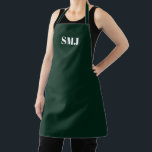 Delantal Iniciales monográficas personalizados modernas de<br><div class="desc">Las iniciales del monograma personalizado moderno son Apron blanco oscuro verde. letras blancas, fondo rosa claro. Puedes elegir tu color de correa. ¡Un gran regalo para mamá, amigos y tú mismo! Diseño moderno, minimalista, sencillo y elegante. Excelente para cocineros, chefs, cerámica, artesanía, trabajo, cocina, horneado, barbacoa, parrilladas, comercios y tiendas,...</div>