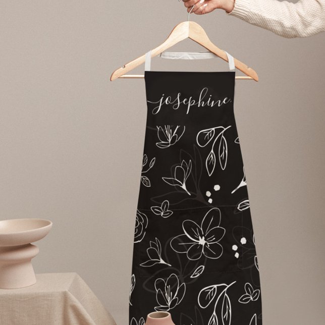 Delantal Linearto floral blanco negro moderno personalizado (Personalized apron with black and white floral design by Lorena Depante.)