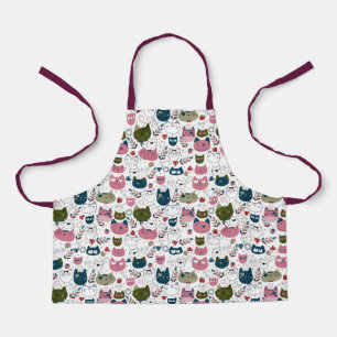 Delantal Los gatos se enfrentan a un patrón rosa verde cáli