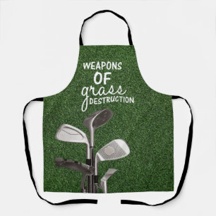 Delantal Los palos de golf están sobre hierba verde