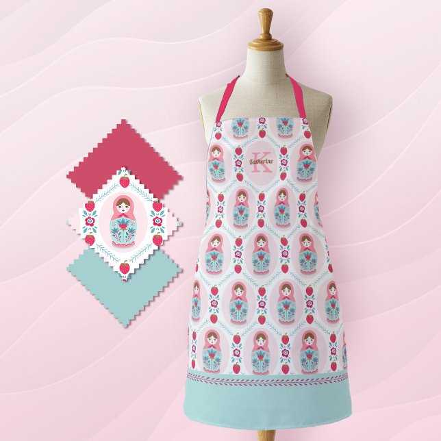 Delantal Monograma Apron con patrón Matryoshka rosa (a cute pink and blue matryoshka nesting doll pattern decorates this apron. add a monogram name!)