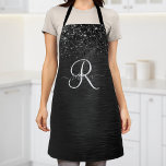 Delantal Monograma de espuma de Purpurina negro personaliza<br><div class="desc">Personalice fácilmente este elegante diseño de delantal con un purpurina brillante negro de bonito sobre un fondo metálico negro cepillado.</div>