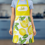 Delantal Monograma limón Citrus amarillo botánico inicial<br><div class="desc">Este delantal monograma presenta un patrón de limón acuarela con marco amarillo en la parte superior donde se puede añadir el nombre y el nombre inicial.</div>