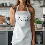 Delantal Monograma negro mínimo<br><div class="desc">Eleva tu estilo de cocina con este Monograma Minimalista Negro. Con un diseño elegante y sencillo, este delantal combina la funcionalidad con la elegancia, lo que lo hace perfecto tanto para cocineros caseros como para chefs profesionales. El monograma de personalizable aporta un toque personal, asegurándose de que se cocina con...</div>