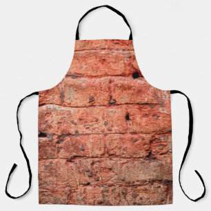 Delantal Muro de ladrillo vintage con algunas piedras en él