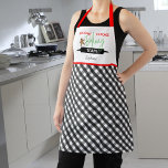 Delantal Navidades del equipo de Holiday Cookie Baking Plai<br><div class="desc">Esta tierna plataforma de Navidades muestra el texto "Equipo de piragüismo de vacaciones". La parte inferior del delantal está cubierta por un tablero de ajedrez blanco y negro. Personaliza este divertido delantal de vacaciones con tu nombre.</div>