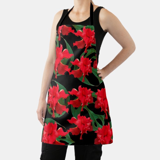 Delantal negro con estampado de hibisco y monstera (in situ)